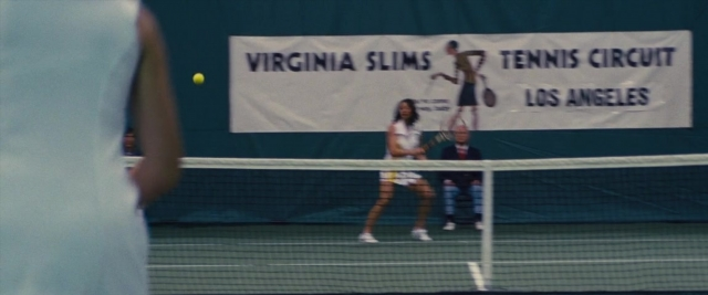 Frame from Battle of the Sexes — sitting, suit, shirt