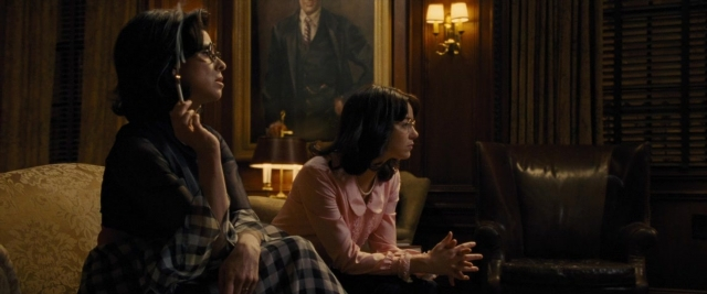 Frame from Battle of the Sexes — sitting, room, phone