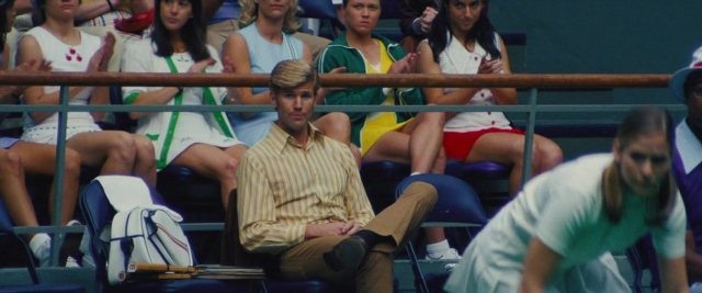 Wide shot frame from Battle of the Sexes — sitting, shirt, chair