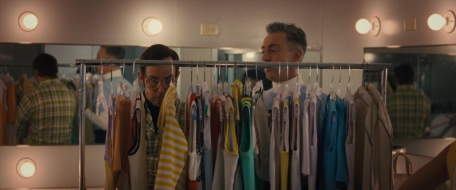 Wide shot frame from Battle of the Sexes — standing, shirt, face