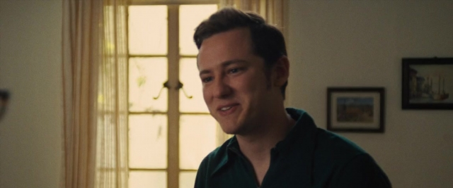 Medium shot frame from Battle of the Sexes — standing, shirt, face