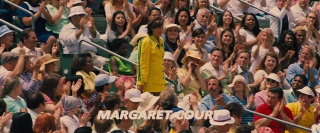 Wide shot frame from Battle of the Sexes — standing, hat, person