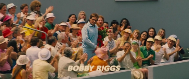 Wide shot frame from Battle of the Sexes — standing, hand, shirt