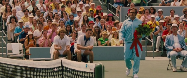 Wide shot frame from Battle of the Sexes — sitting, standing, walking