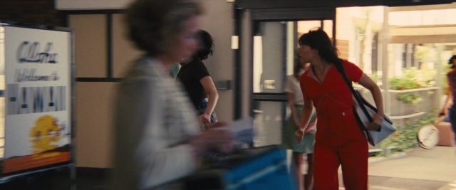 Frame from Battle of the Sexes — standing, walking, door