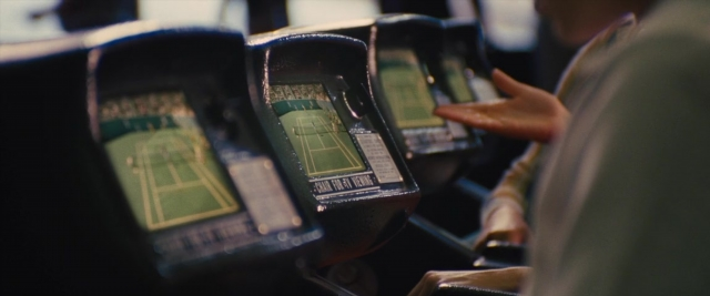 Medium shot frame from Battle of the Sexes — phone, hand, train