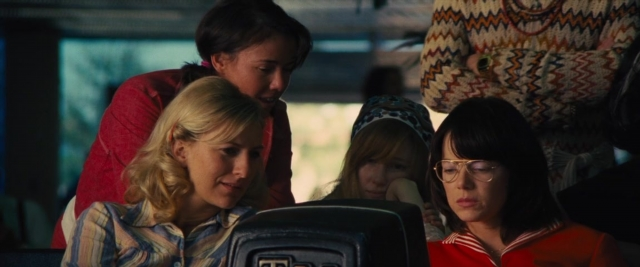 Wide shot frame from Battle of the Sexes — sitting, car, shirt