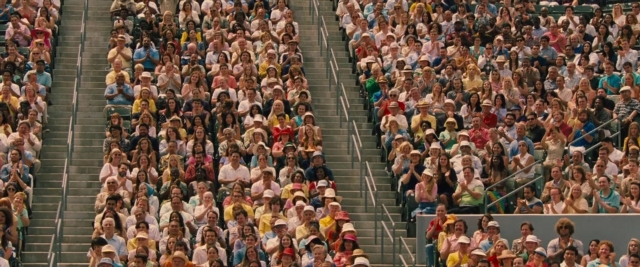 Wide shot frame from Battle of the Sexes — sitting, person, human face
