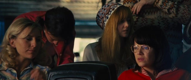 Medium shot frame from Battle of the Sexes — sitting, car, shirt