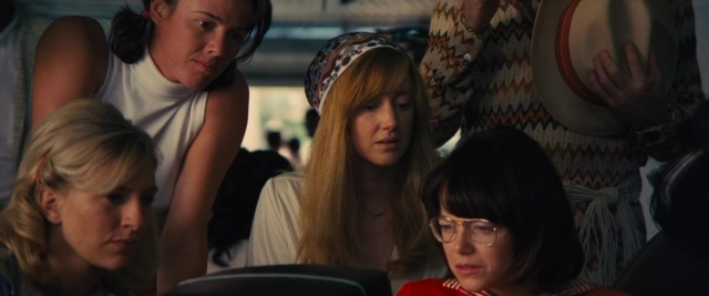 Medium shot frame from Battle of the Sexes — sitting, standing, room