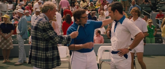 Wide shot frame from Battle of the Sexes — standing, shirt, person