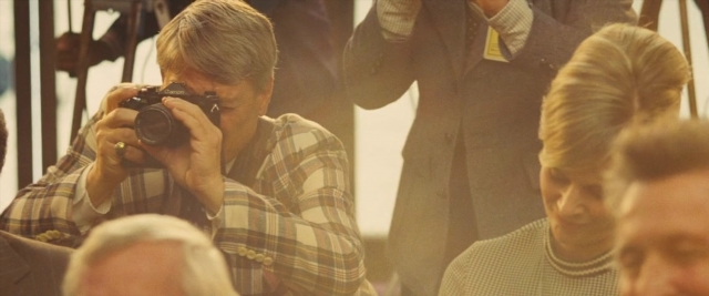 Frame from Battle of the Sexes — room, shirt, face