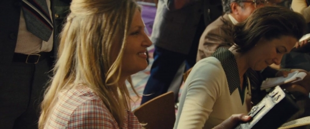 Wide shot frame from Battle of the Sexes — sitting, table, dialogue