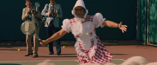 Wide shot frame from Battle of the Sexes — standing, hat, dress
