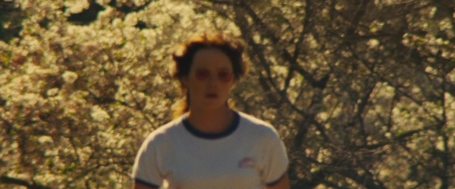 Wide shot frame from Battle of the Sexes — standing, shirt, face