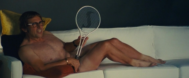 Frame from Battle of the Sexes — sitting, hand, couch