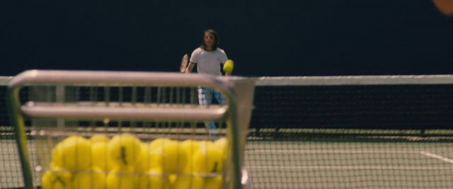 Frame from Battle of the Sexes — standing, shirt, person