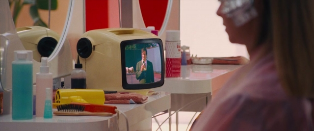 Frame from Battle of the Sexes — sitting, table, mirror