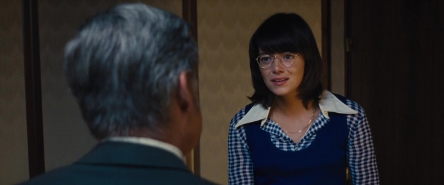 Wide shot frame from Battle of the Sexes — standing, room, door