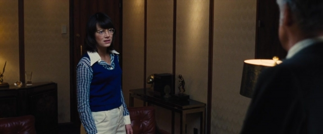 Wide shot frame from Battle of the Sexes — standing, room, dialogue