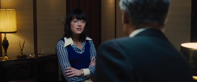 Wide shot frame from Battle of the Sexes — standing, room, dialogue