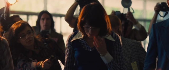Wide shot frame from Battle of the Sexes — room, dialogue, phone