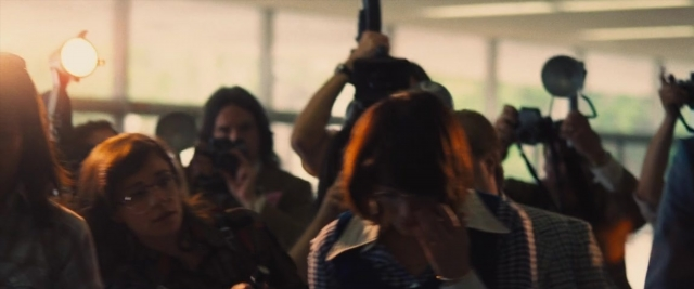 Wide shot frame from Battle of the Sexes — room, dialogue, camera