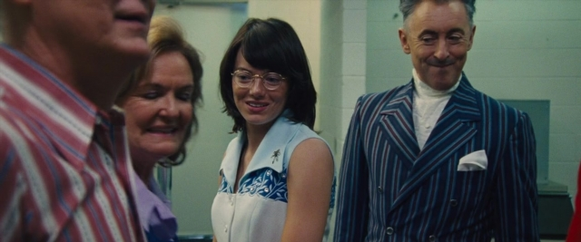 Medium shot frame from Battle of the Sexes — standing, room, dialogue