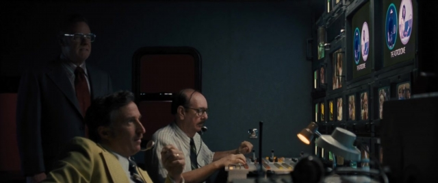Wide shot frame from Battle of the Sexes — room, dialogue, person