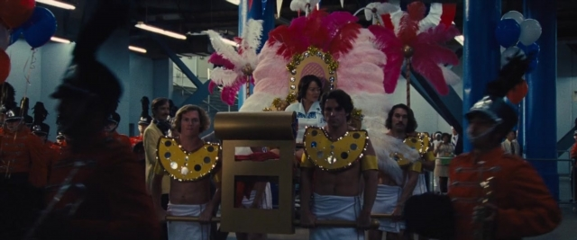 Wide shot frame from Battle of the Sexes — room, mirror, dress