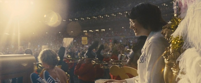 Frame from Battle of the Sexes — sitting, chair, hair