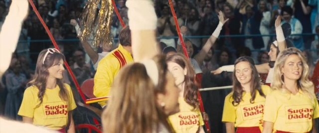 Medium shot frame from Battle of the Sexes — standing, person, human face