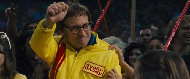 Medium shot frame from Battle of the Sexes — standing, night, face