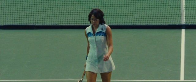 Wide shot frame from Battle of the Sexes — standing, hand, dress