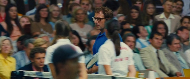Wide shot frame from Battle of the Sexes — standing, dialogue, tie