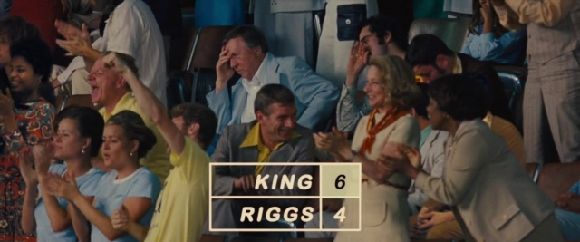 Wide shot frame from Battle of the Sexes — suit, shirt, face