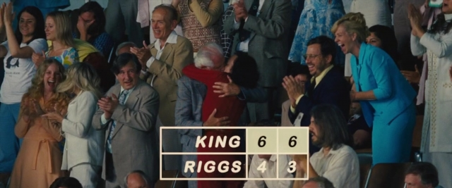 Wide shot frame from Battle of the Sexes — suit, tie, person