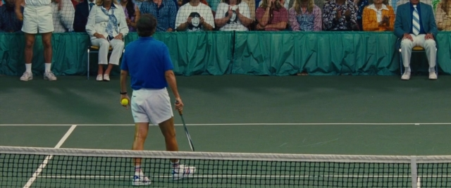 Wide shot frame from Battle of the Sexes — sitting, standing, shirt