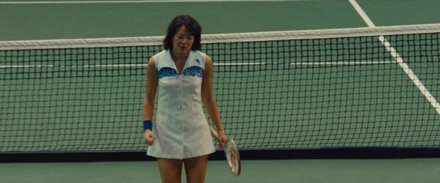 Wide shot frame from Battle of the Sexes — standing, hand, dress