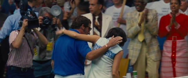 Wide shot frame from Battle of the Sexes — tie, dress, shirt