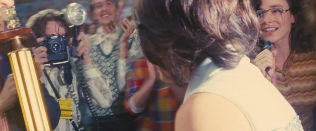 Wide shot frame from Battle of the Sexes — room, dialogue, dress