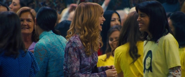 Wide shot frame from Battle of the Sexes — standing, dialogue, hair