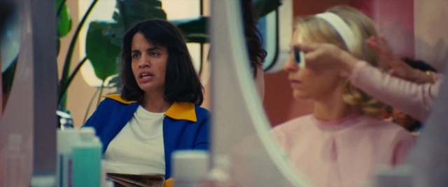 Wide shot frame from Battle of the Sexes — sitting, room, mirror