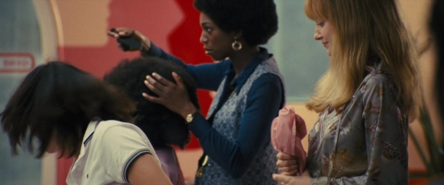 Wide shot frame from Battle of the Sexes — people, action, show