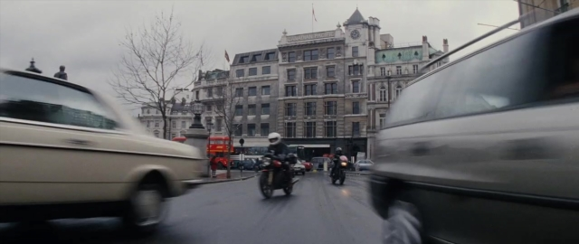 Frame from 101 Dalmatians — street, flag, car