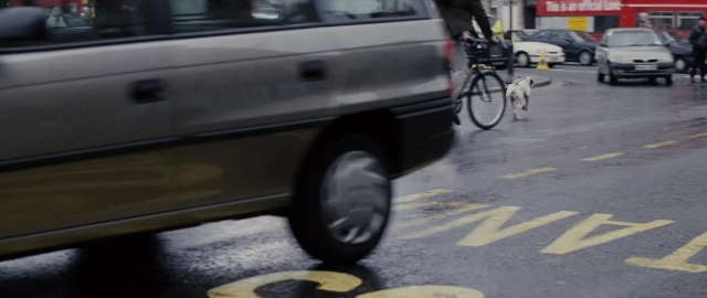 Frame from 101 Dalmatians — street, dog, car