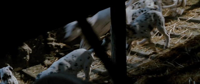 Wide shot frame from 101 Dalmatians — standing, bed, animal