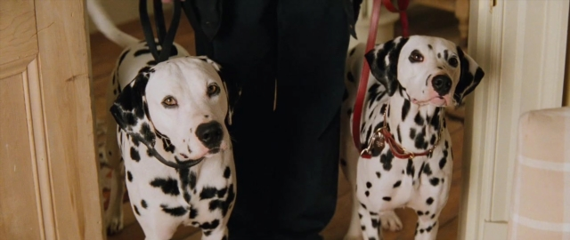 Wide shot frame from 101 Dalmatians — standing, door, dog