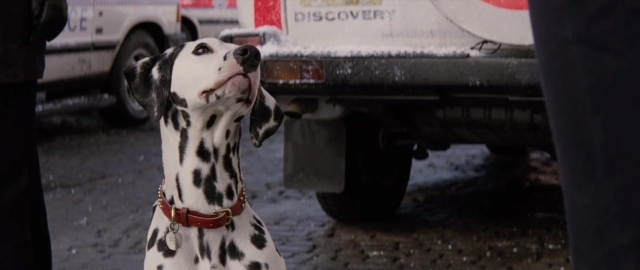 Medium shot frame from 101 Dalmatians — sitting, street, dog
