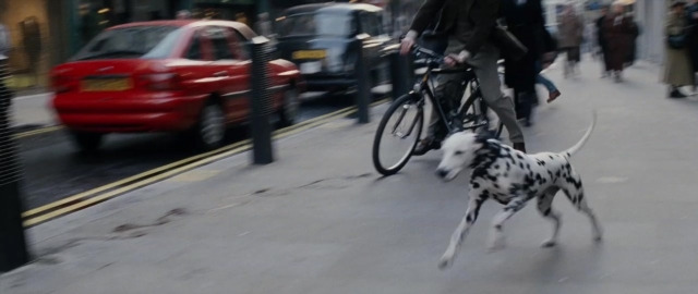 Frame from 101 Dalmatians — walking, street, dog